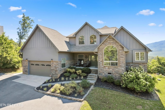 craftsman inspired home with covered porch and a garage