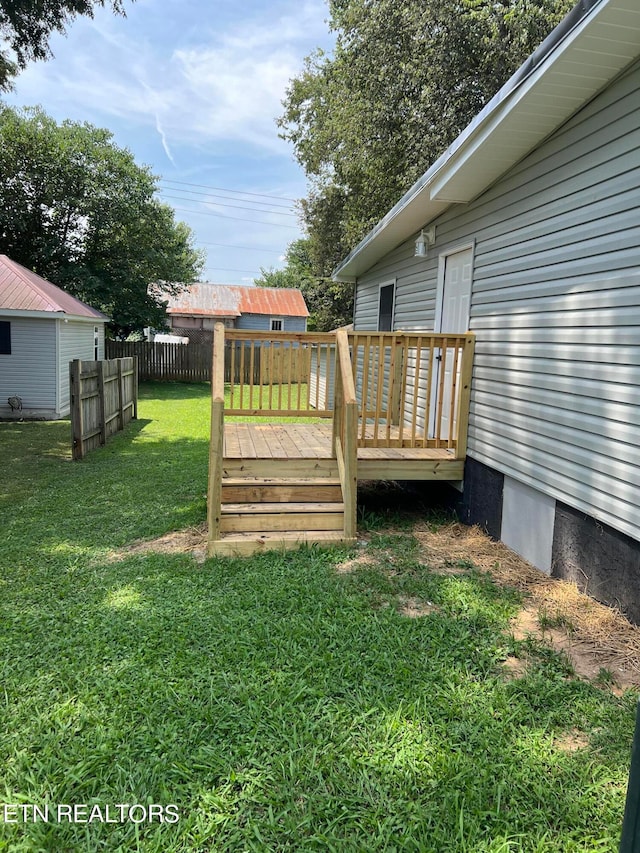 view of yard featuring a wooden deck