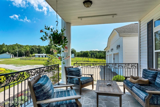 view of patio featuring a garage and outdoor lounge area