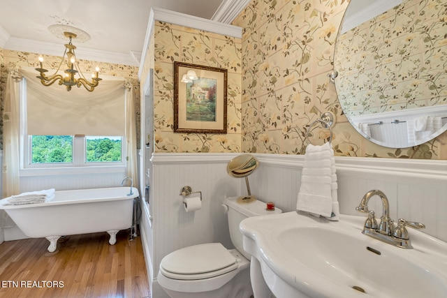 bathroom featuring hardwood / wood-style flooring, toilet, and ornamental molding