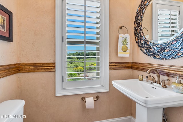 bathroom with sink and toilet