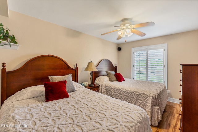 bedroom featuring wood-type flooring and ceiling fan