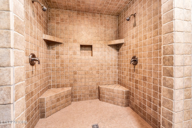 bathroom featuring tiled shower