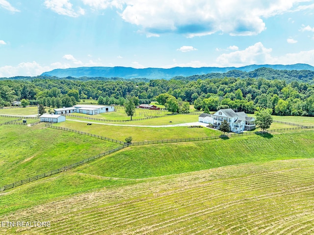 drone / aerial view with a mountain view and a rural view