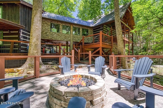 view of patio / terrace featuring a fire pit