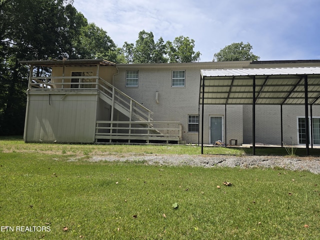 back of property featuring a yard