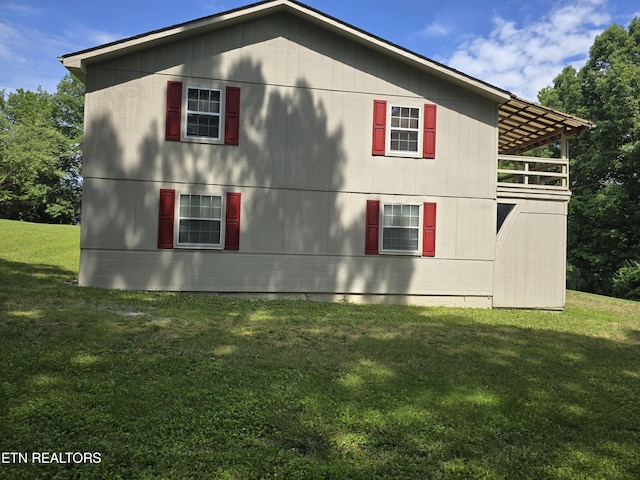 view of home's exterior featuring a yard