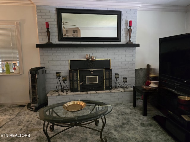 living room featuring ornamental molding and a wood stove