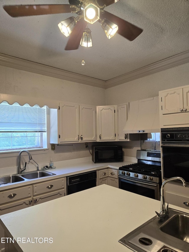 kitchen featuring ceiling fan, sink, black appliances, white cabinets, and exhaust hood