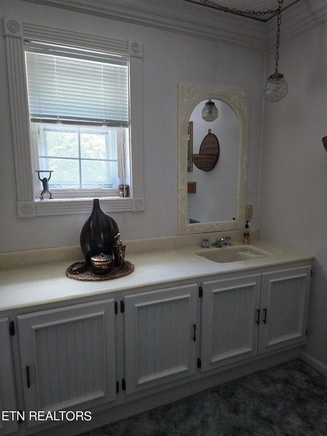 bathroom featuring vanity and crown molding