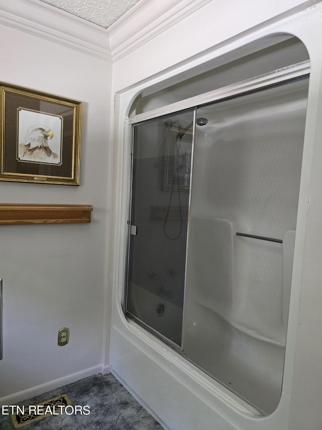 bathroom featuring crown molding, enclosed tub / shower combo, and a textured ceiling