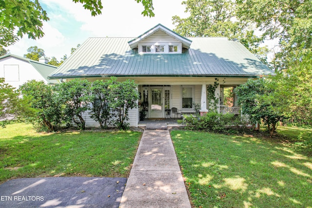 view of front facade with a porch and a front lawn