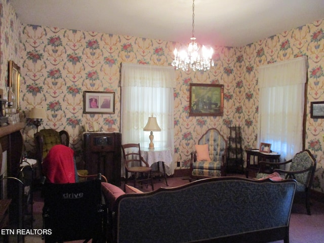 living room with a chandelier and carpet