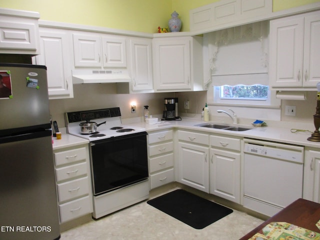 kitchen featuring white cabinets, sink, and white appliances