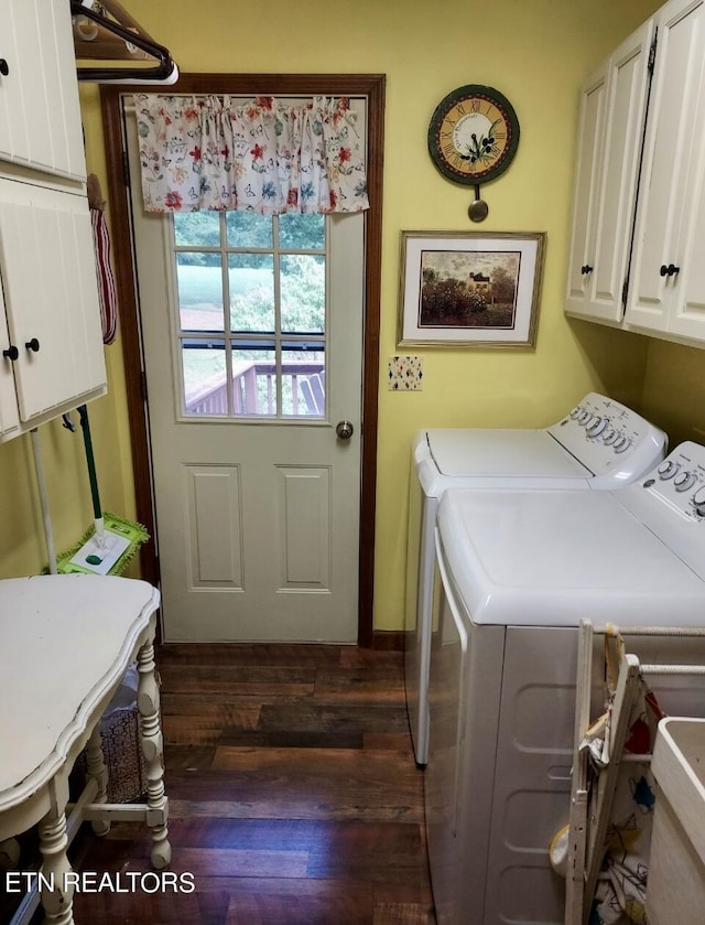 washroom featuring cabinet space, separate washer and dryer, and wood finished floors