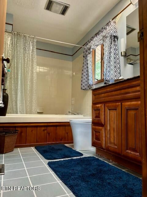 bathroom featuring tile patterned floors and shower / tub combo with curtain