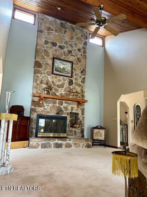 175 Snead Dr, Crossville, TN 38558 - living room featuring a high ceiling, a fireplace, a ceiling fan, wooden ceiling, and carpet floors