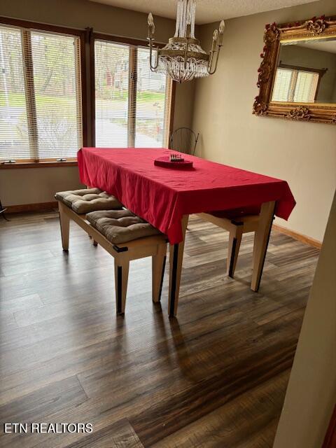 175 Snead Dr, Crossville, TN 38558 - dining space with baseboards, wood finished floors, and a chandelier