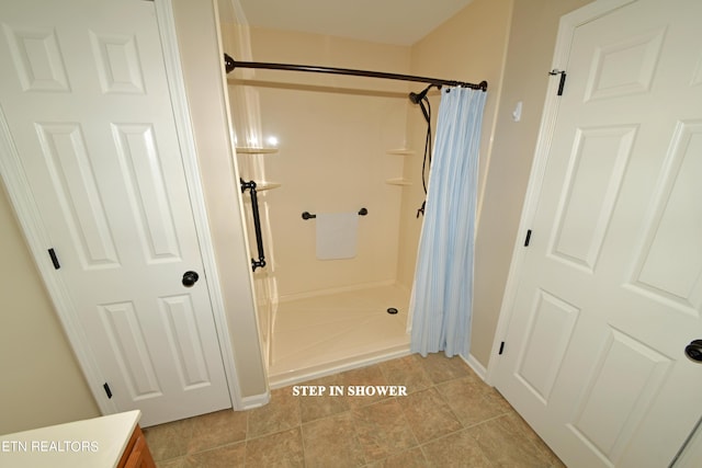 bathroom with a shower with shower curtain