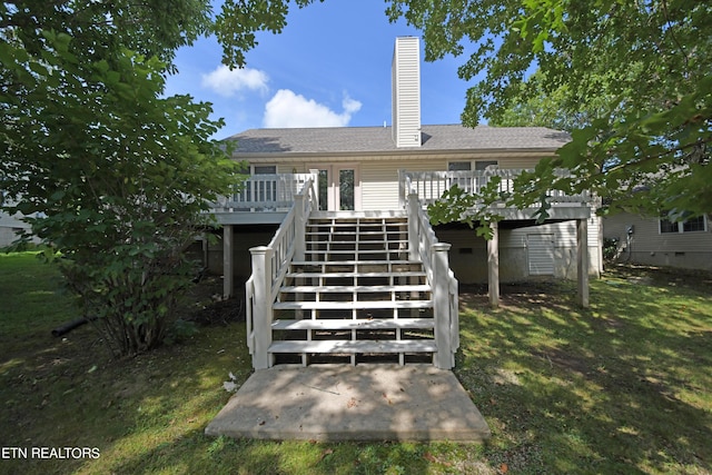 back of house featuring a deck