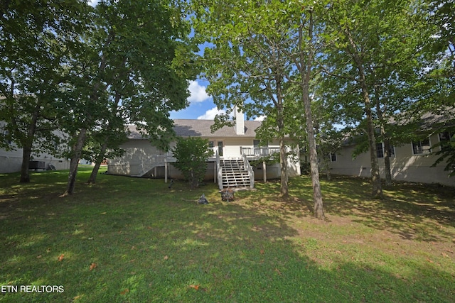 view of yard with a wooden deck