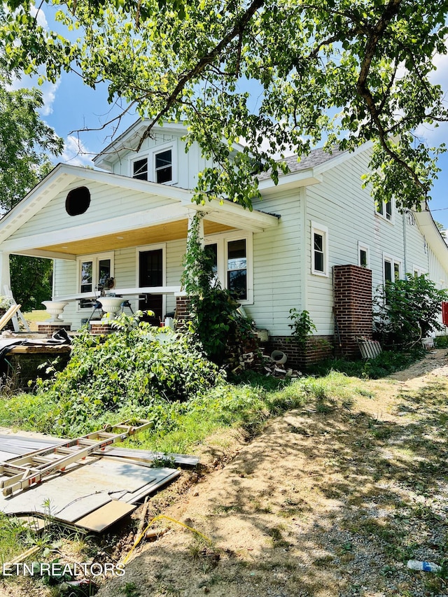 back of house with a porch