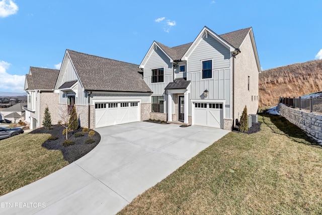 view of front of property with a garage and a front yard