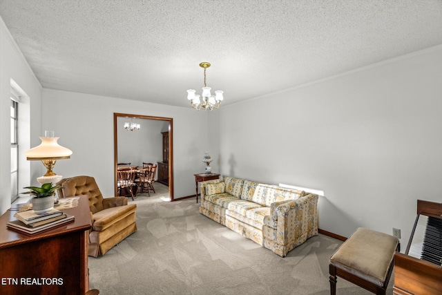 living room featuring light carpet, a notable chandelier, and a textured ceiling