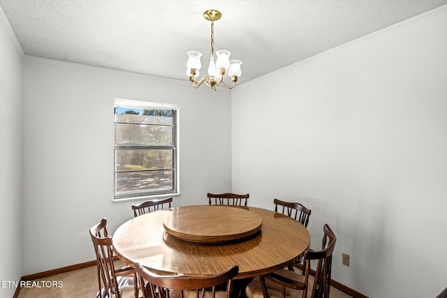 dining room with carpet floors, a textured ceiling, and an inviting chandelier