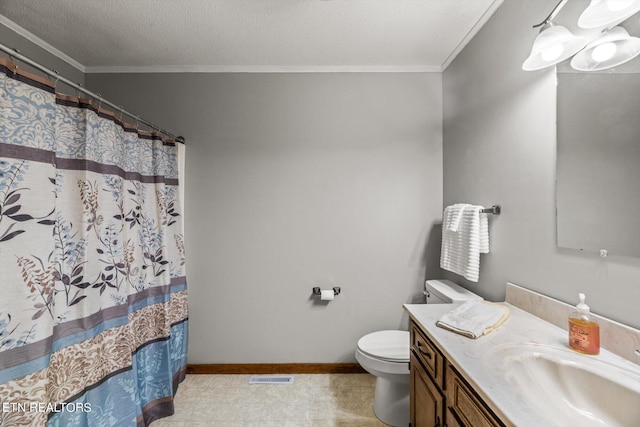 bathroom featuring ornamental molding, vanity, a textured ceiling, and toilet