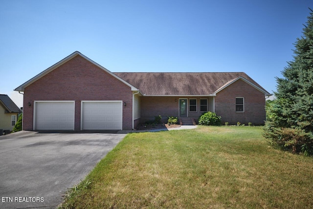 ranch-style house with a front yard and a garage