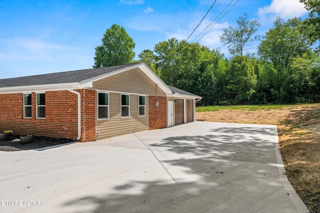 view of side of property featuring a garage