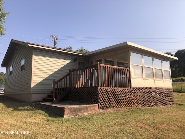 exterior space featuring a yard and a deck