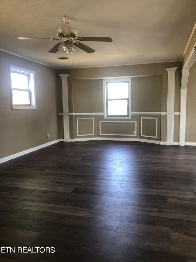 spare room with crown molding, dark hardwood / wood-style flooring, and ceiling fan