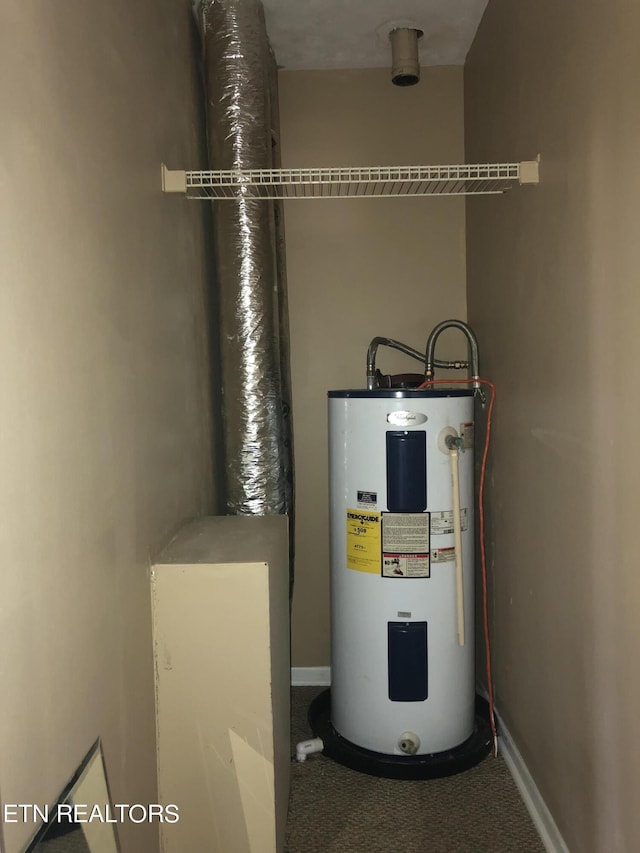 utility room featuring water heater