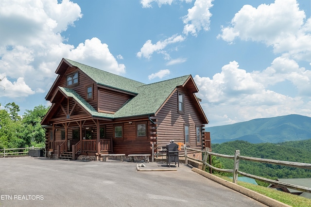 back of house with a mountain view