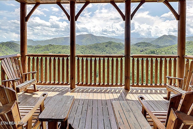 wooden terrace featuring a mountain view