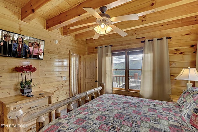 bedroom with ceiling fan, wood ceiling, wood walls, and beamed ceiling