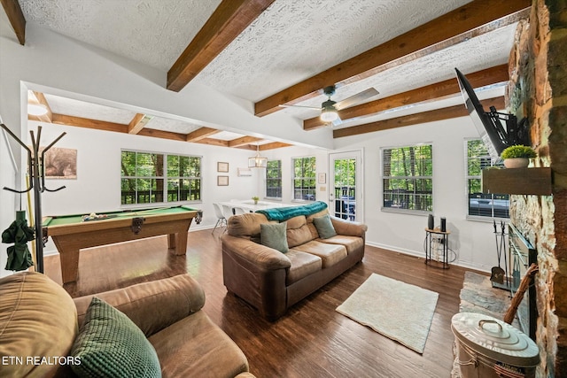 living room with a textured ceiling, beamed ceiling, dark hardwood / wood-style floors, billiards, and ceiling fan