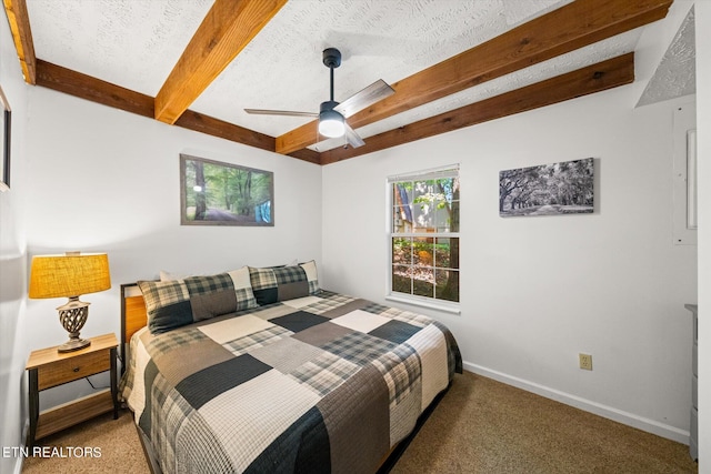 bedroom featuring a textured ceiling, ceiling fan, carpet, and beamed ceiling