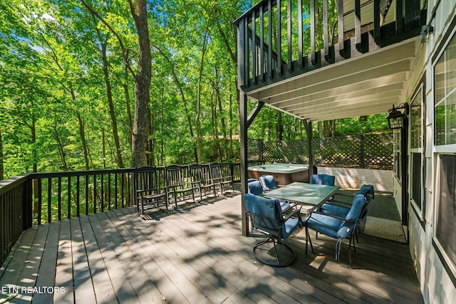 deck featuring a hot tub