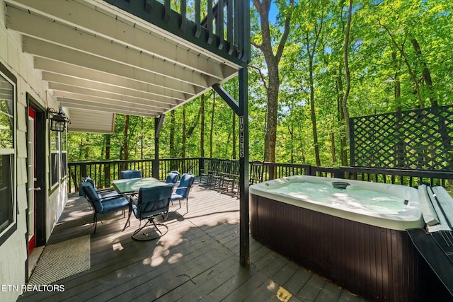 deck with a hot tub