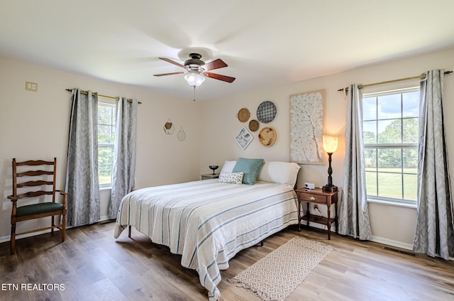 bedroom featuring wood-type flooring and ceiling fan