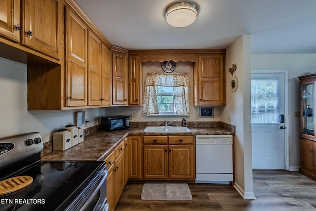 kitchen featuring sink, electric stove, dark hardwood / wood-style floors, and white dishwasher