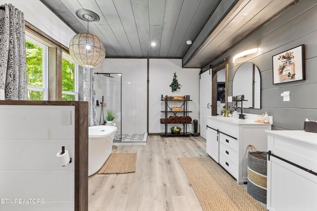 bathroom featuring vanity, shower with separate bathtub, wooden ceiling, and wood-type flooring