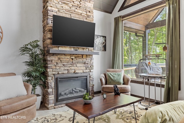 living room with lofted ceiling and a fireplace