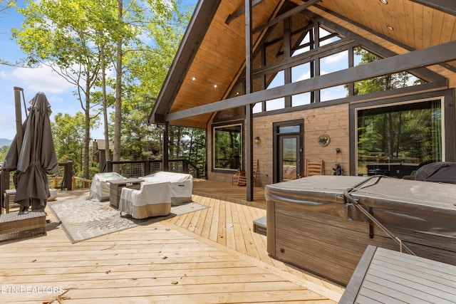 deck featuring a hot tub