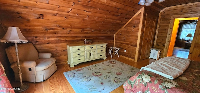 unfurnished room featuring wooden ceiling, vaulted ceiling, and light hardwood / wood-style flooring