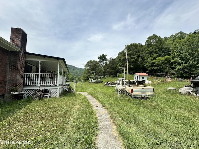 view of yard featuring a porch