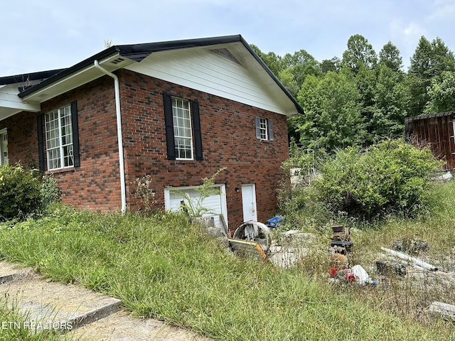 view of home's exterior with a garage